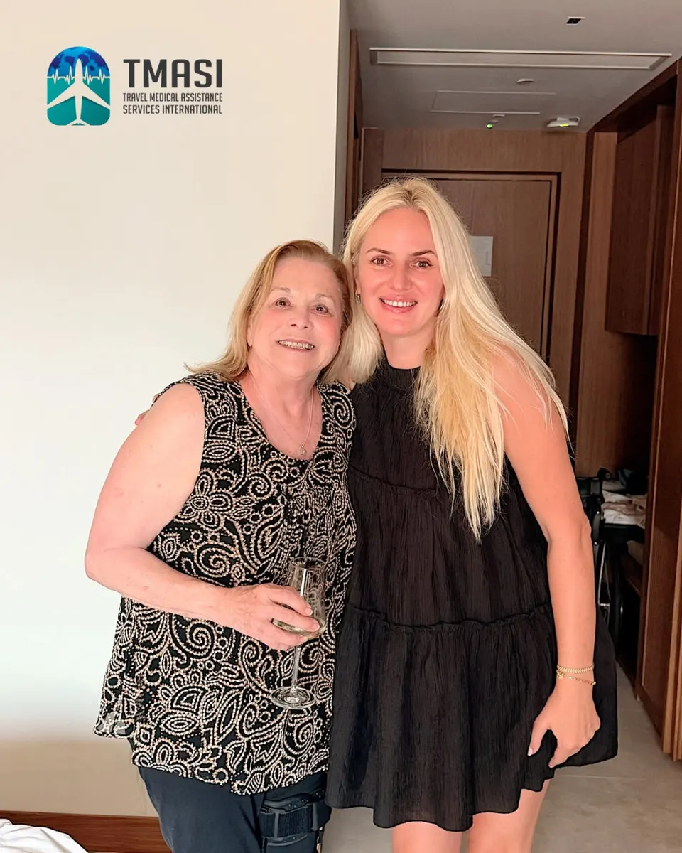 A guest and a TMASI representative together in the hotel room on her birthday
