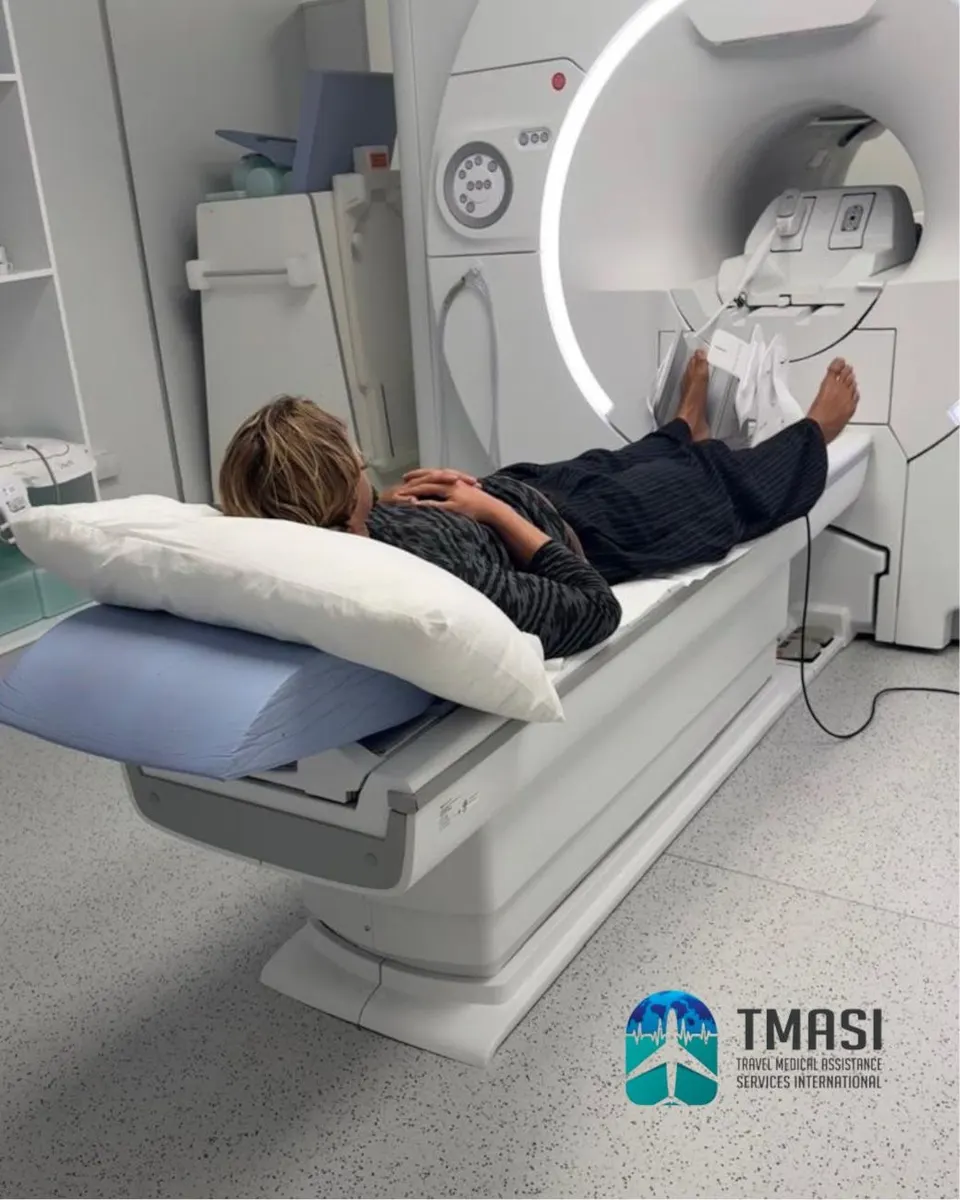 A patient lying on an MRI scanner table