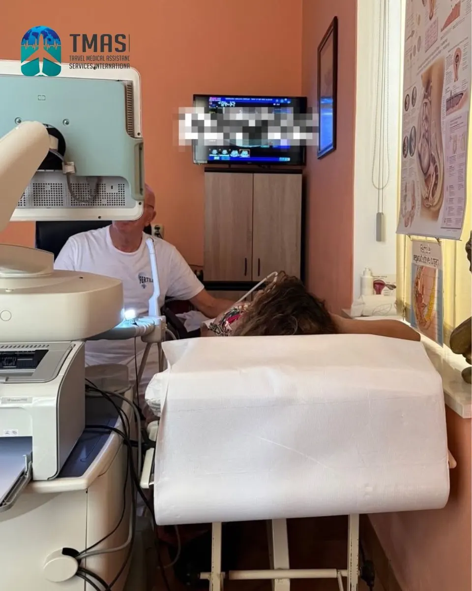 A guest during an ultrasound examination, with a TMASI representative in the room